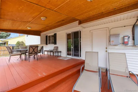 a view of dining room with furniture and floor to ceiling window