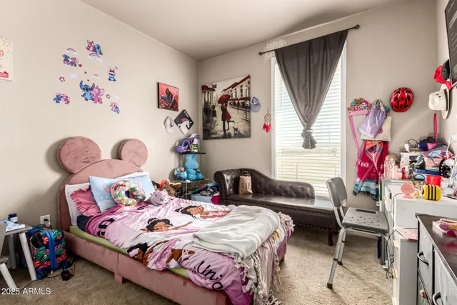 a bedroom with a bed and furniture