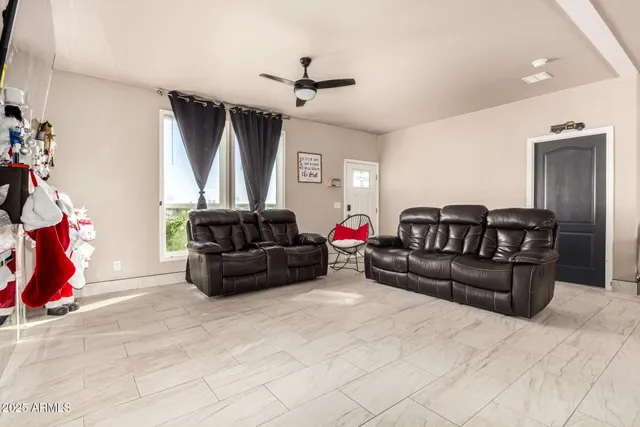 a living room with furniture a couch and a window