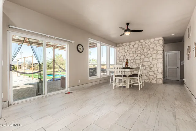 a dining room with furniture and window