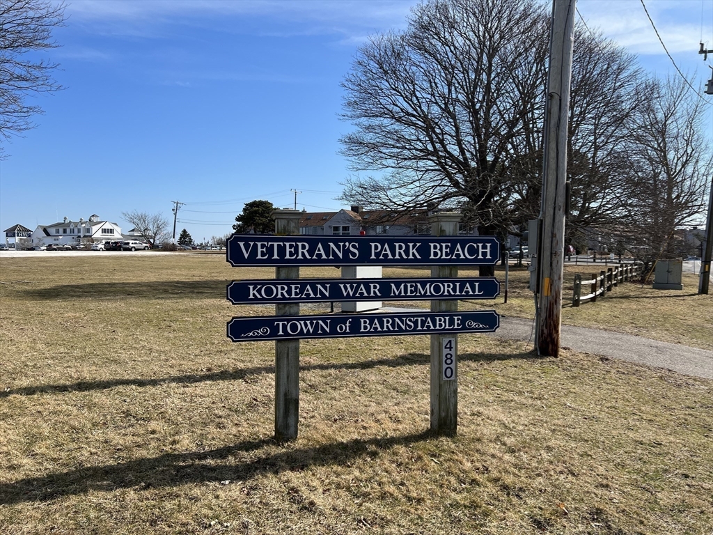 89 Lewis Road, Unit 303 Hyannis, MA 02601 - Photo 34 of 39 a view of a street with benches and a big yard