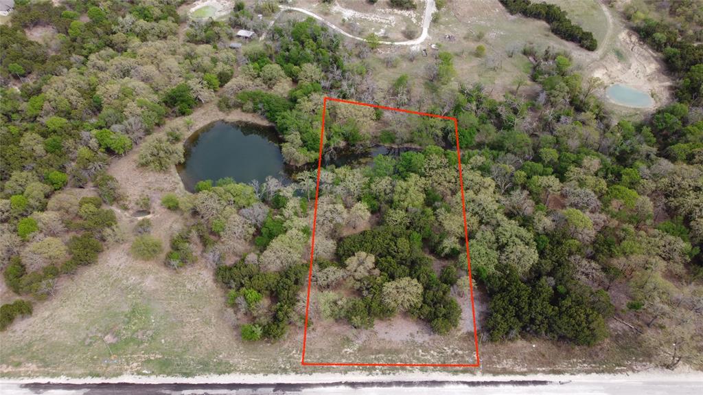 1045 Creek Crossing Road Nemo, TX 76070 - Photo 3 of 15 a view of a yard with a tree