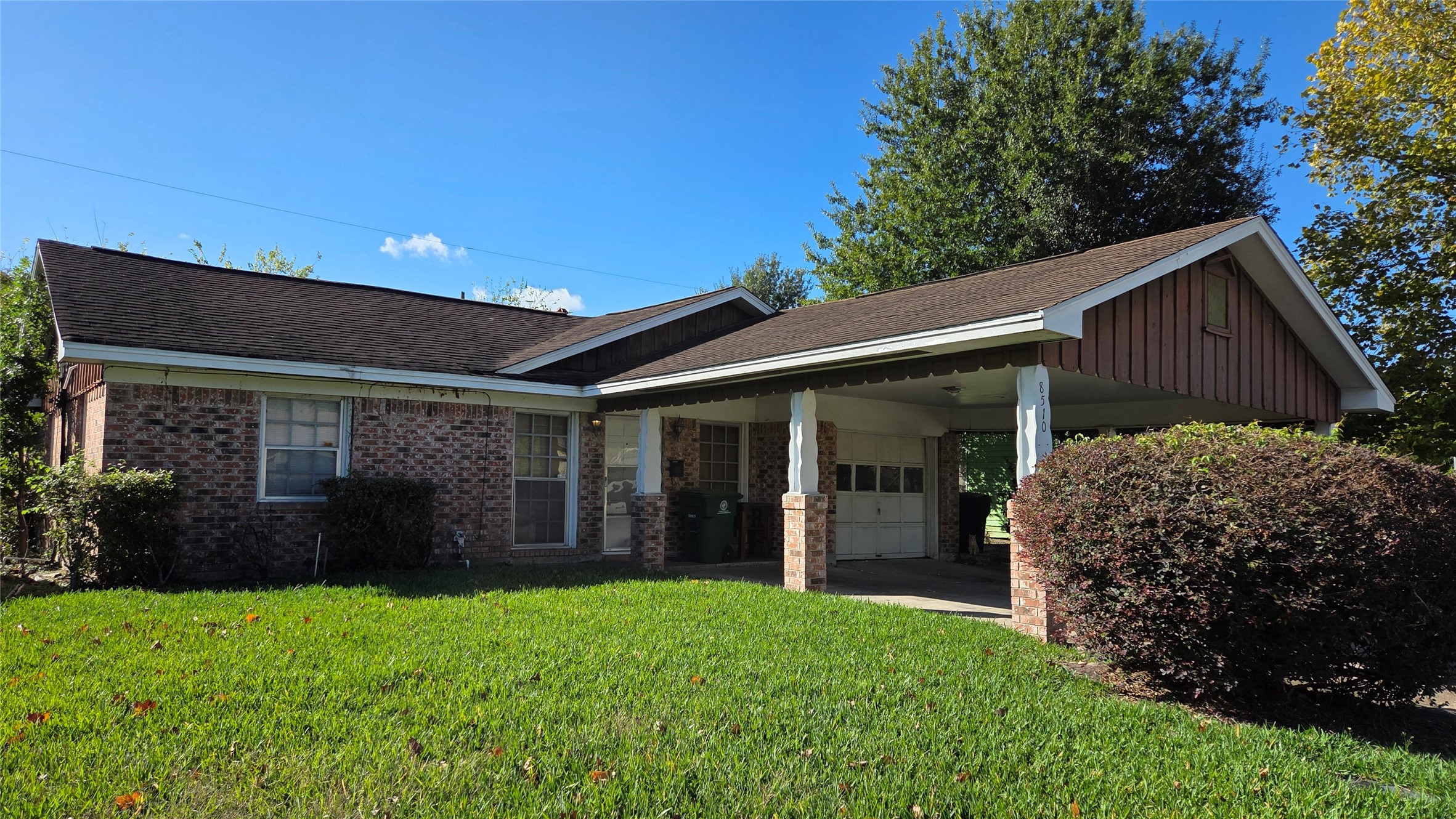 8510 Cowart Street Houston, TX 77029 - Photo 1 of 12 front view of a house with a yard
