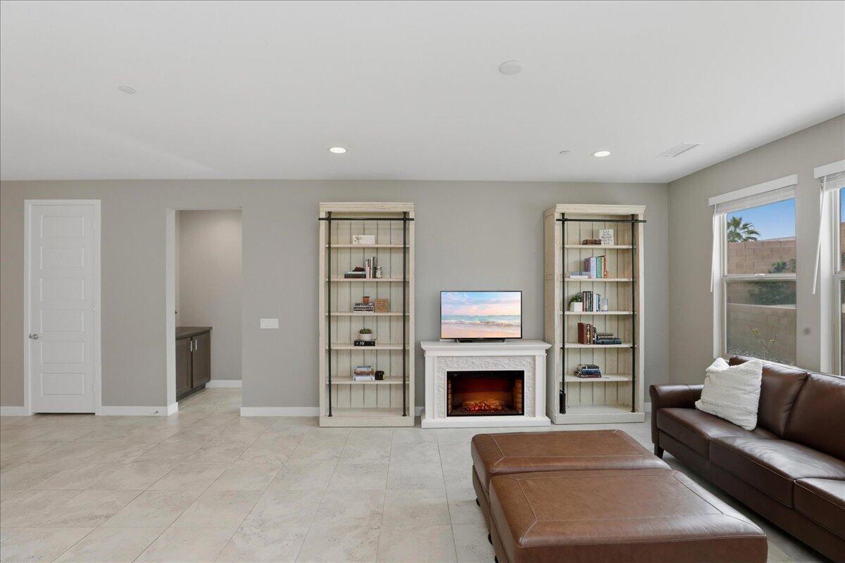 73721 Raphael Drive Palm Desert, CA 92211 - Photo 12 of 54 a living room with furniture and a fireplace