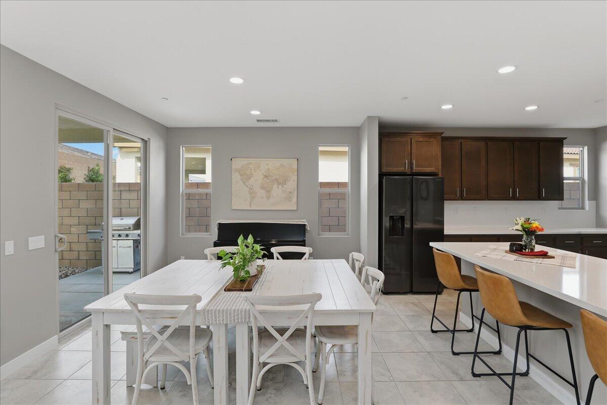 73721 Raphael Drive Palm Desert, CA 92211 - Photo 14 of 54 a kitchen with a table and chairs in it