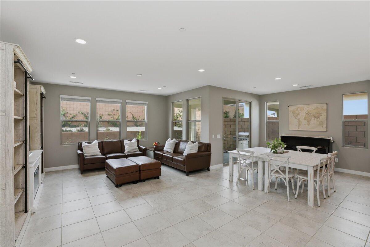 73721 Raphael Drive Palm Desert, CA 92211 - Photo 2 of 54 a living room with furniture and a large window