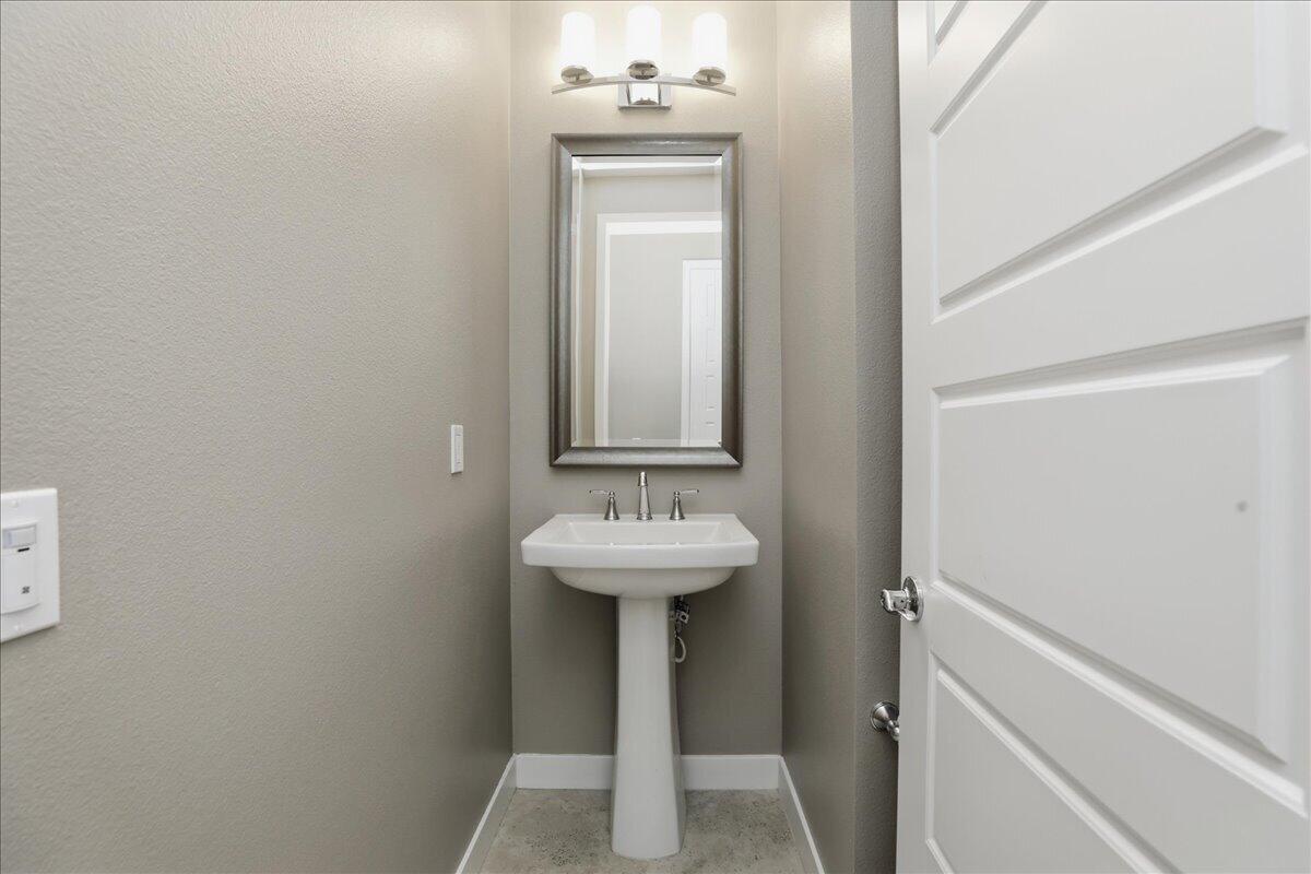 73721 Raphael Drive Palm Desert, CA 92211 - Photo 22 of 54 a bathroom with a sink and a mirror