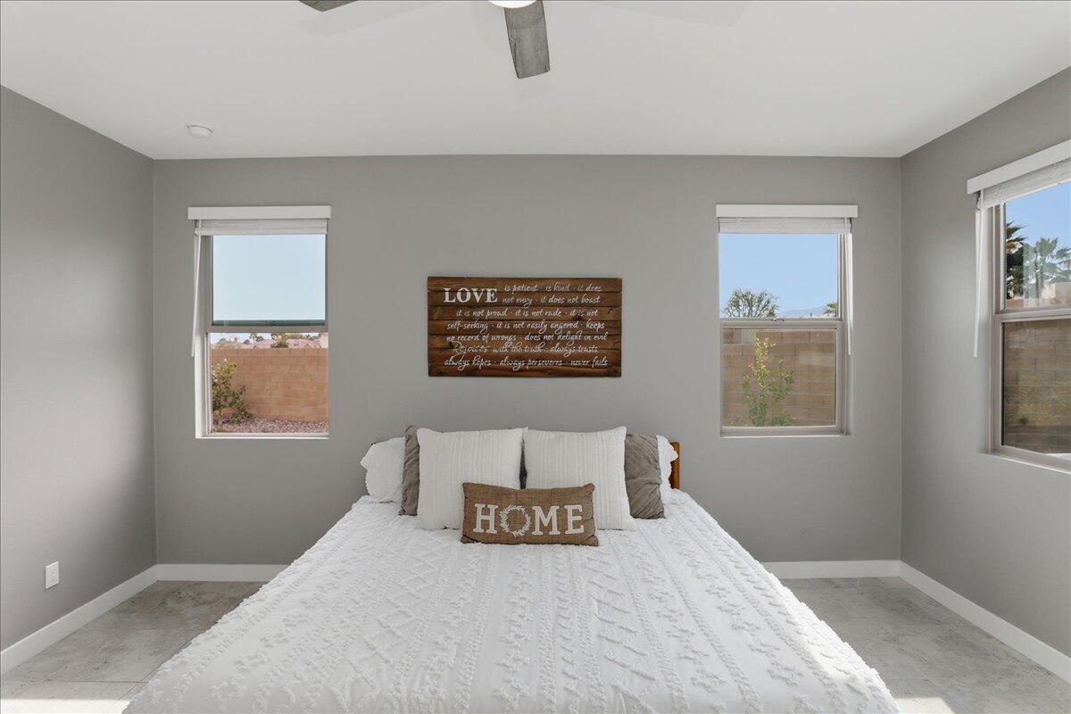 73721 Raphael Drive Palm Desert, CA 92211 - Photo 28 of 54 a bedroom with a bed and a window