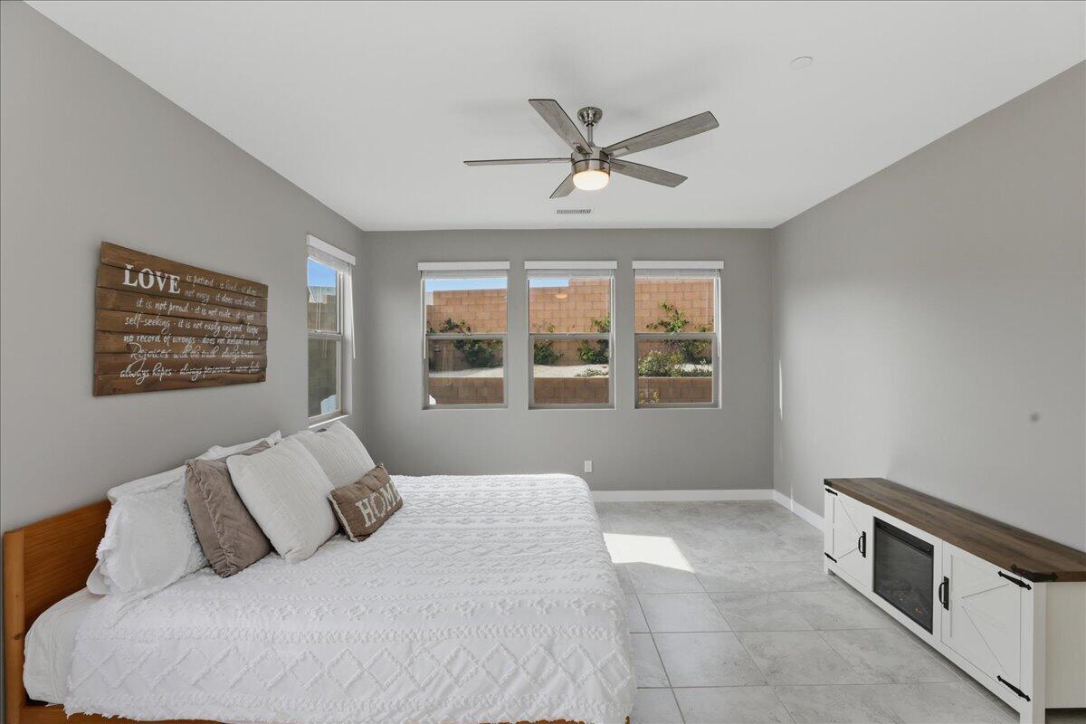 73721 Raphael Drive Palm Desert, CA 92211 - Photo 29 of 54 a bedroom with a large bed and a window