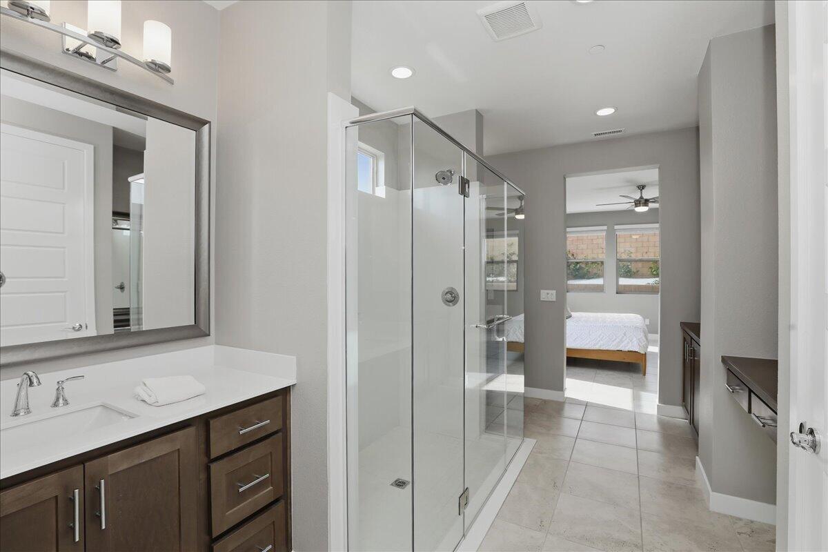 73721 Raphael Drive Palm Desert, CA 92211 - Photo 32 of 54 a bathroom with a sink a toilet and shower