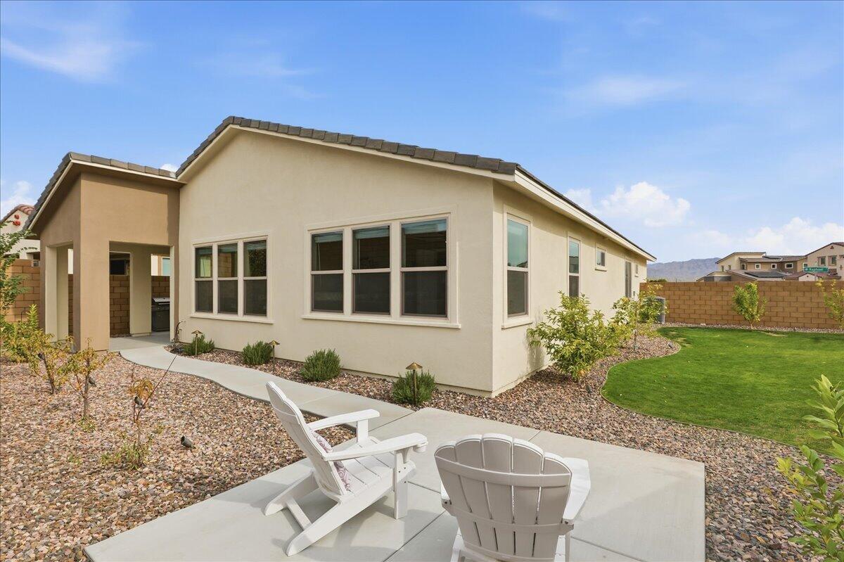 73721 Raphael Drive Palm Desert, CA 92211 - Photo 33 of 54 a house view with a garden space