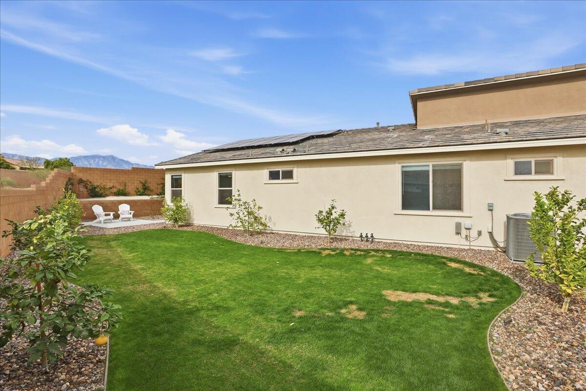 73721 Raphael Drive Palm Desert, CA 92211 - Photo 34 of 54 a front view of a house with garden
