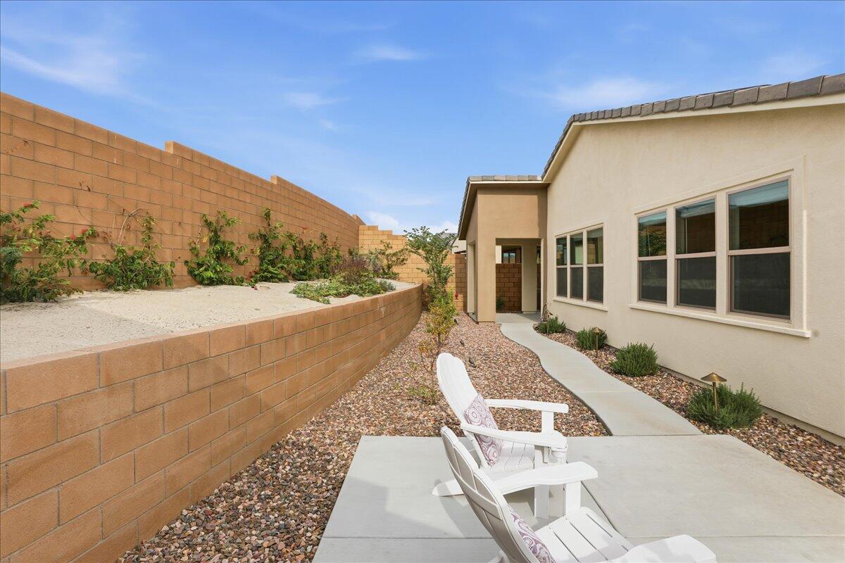 73721 Raphael Drive Palm Desert, CA 92211 - Photo 38 of 54 a front view of a house with a yard