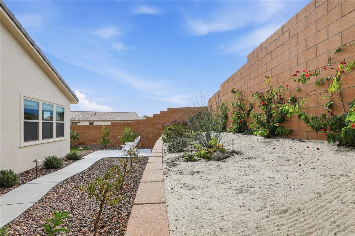 73721 Raphael Drive Palm Desert, CA 92211 - Photo 45 of 54 a view of a backyard with potted plants