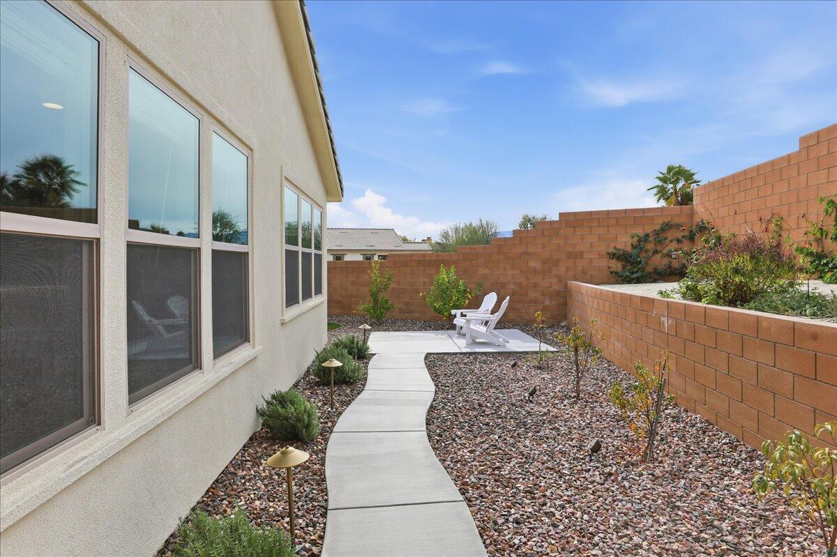 73721 Raphael Drive Palm Desert, CA 92211 - Photo 46 of 54 a view of a backyard with sitting area