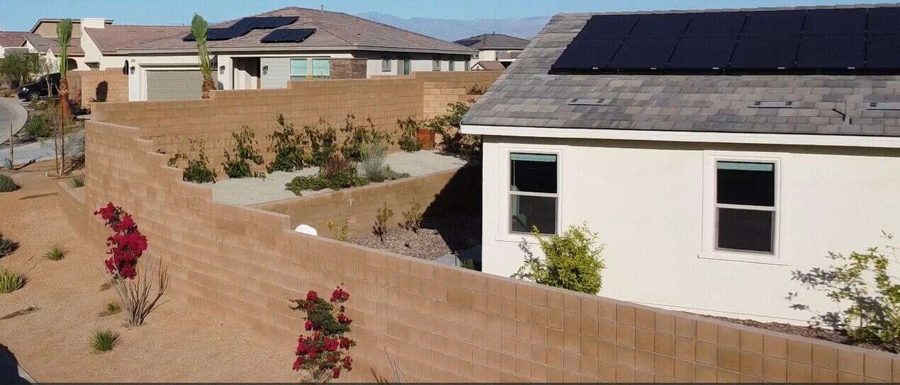 73721 Raphael Drive Palm Desert, CA 92211 - Photo 50 of 54 a front view of a house with a yard