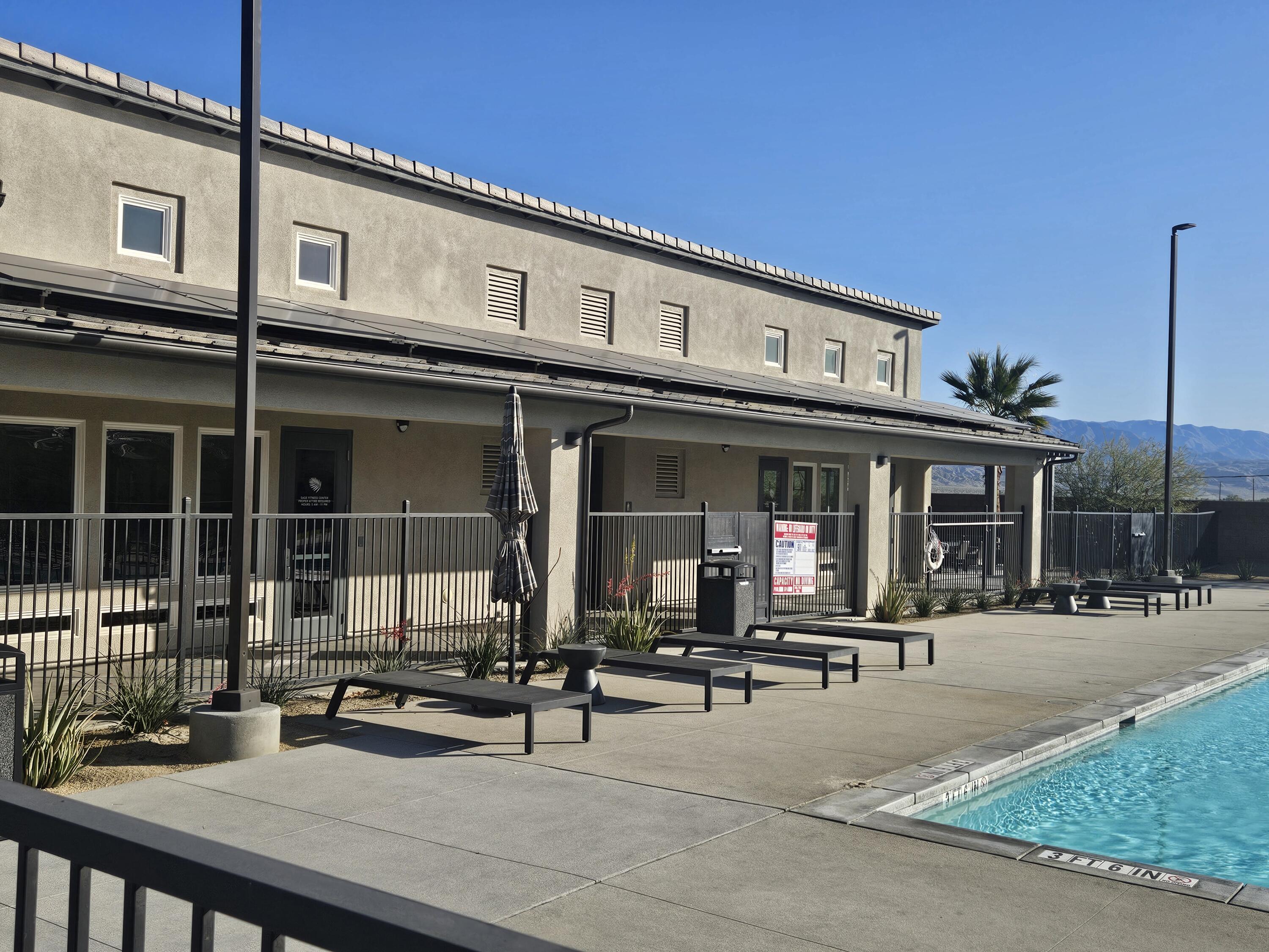 73721 Raphael Drive Palm Desert, CA 92211 - Photo 53 of 54 a front view of a building with sitting area