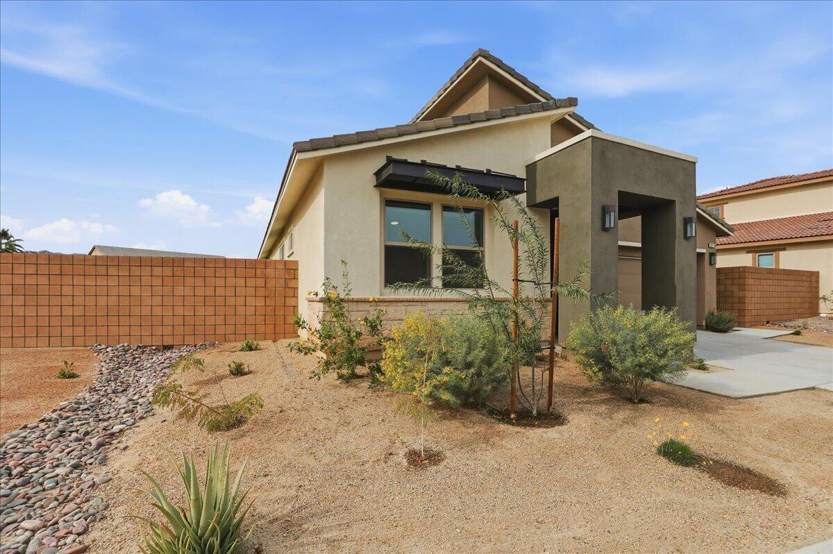 73721 Raphael Drive Palm Desert, CA 92211 - Photo 6 of 54 a front view of a house