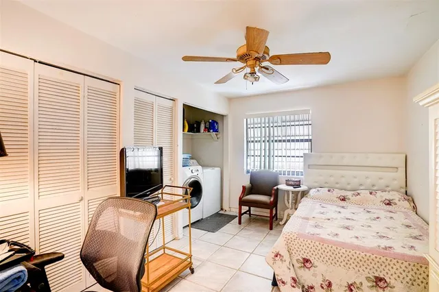 a bedroom with a bed and chair