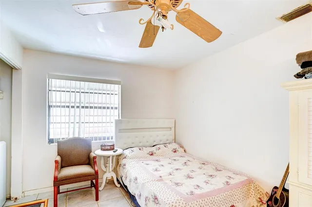 a kitchen with cabinets appliances a sink and a window