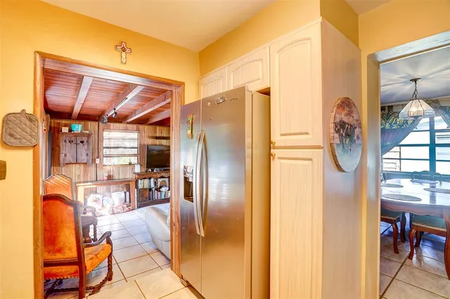 a living room with lots of furniture and a chandelier