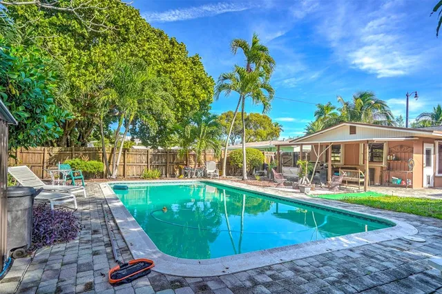 an aerial view of a house with garden space and street view