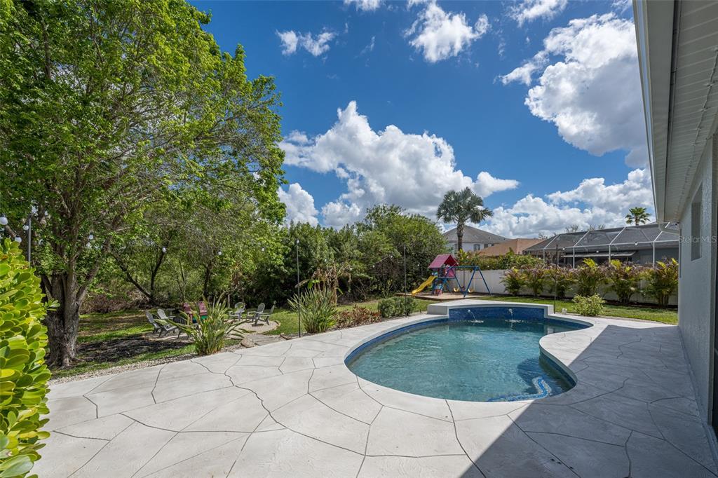 4136 Little Gap Loop Ellenton, FL 34222 - Photo 11 of 50 a view of a swimming pool with a patio