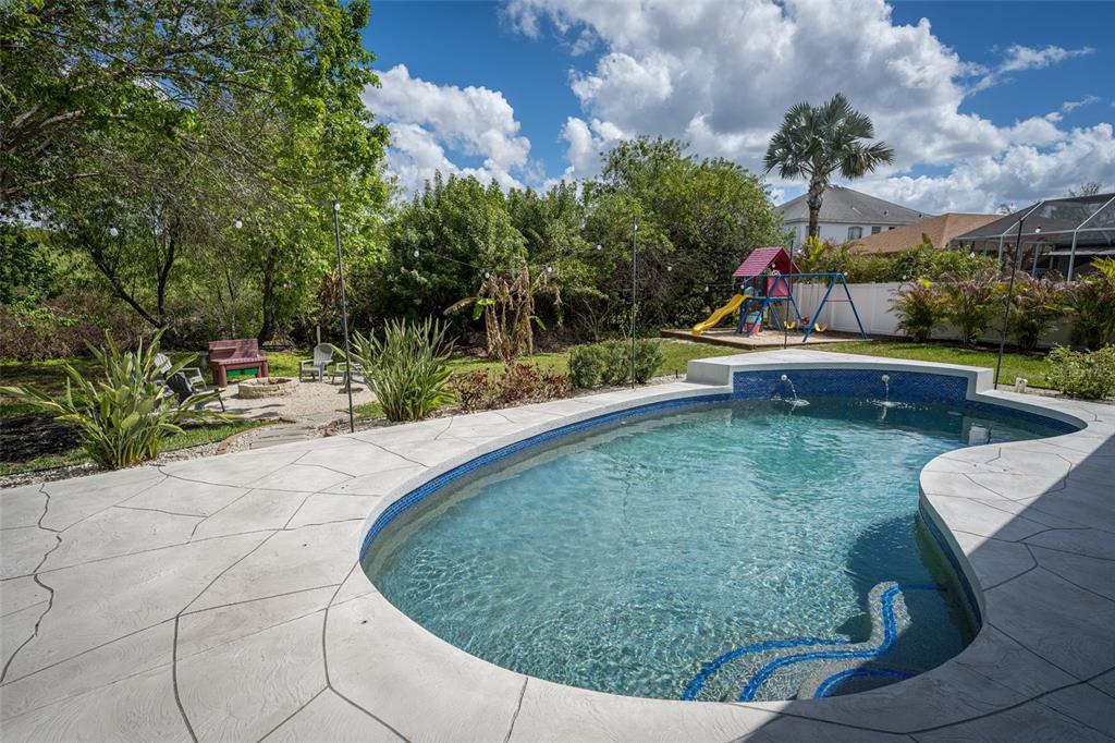 4136 Little Gap Loop Ellenton, FL 34222 - Photo 12 of 50 a view of a swimming pool with a outdoor seating
