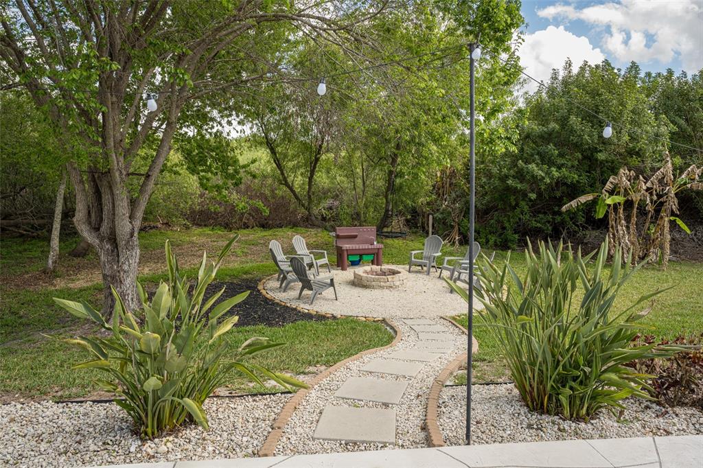 4136 Little Gap Loop Ellenton, FL 34222 - Photo 15 of 50 a view of a backyard with sitting area