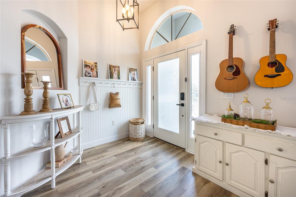 4136 Little Gap Loop Ellenton, FL 34222 - Photo 17 of 50 a very nice looking room with a wooden floor and a book shelf