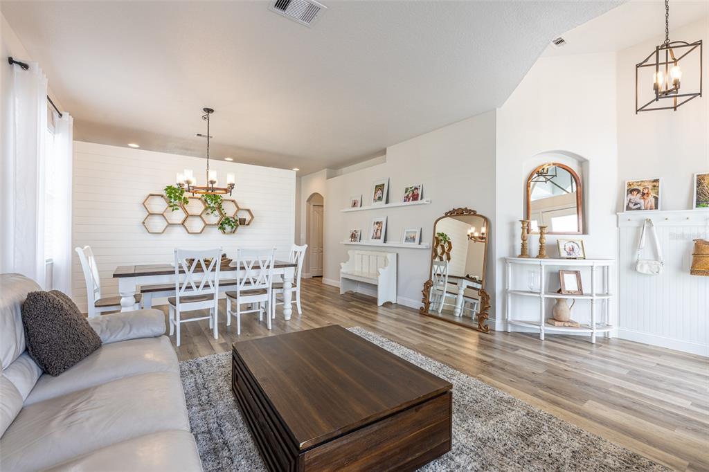 4136 Little Gap Loop Ellenton, FL 34222 - Photo 18 of 50 a living room with furniture and a wooden floor