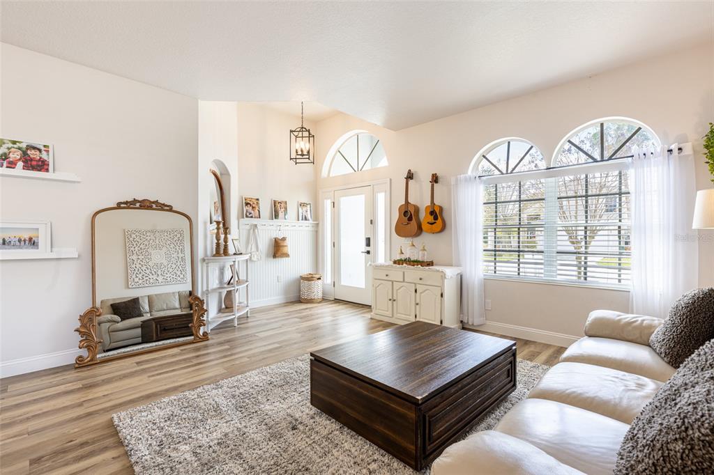 4136 Little Gap Loop Ellenton, FL 34222 - Photo 19 of 50 a living room with furniture a table and a large window