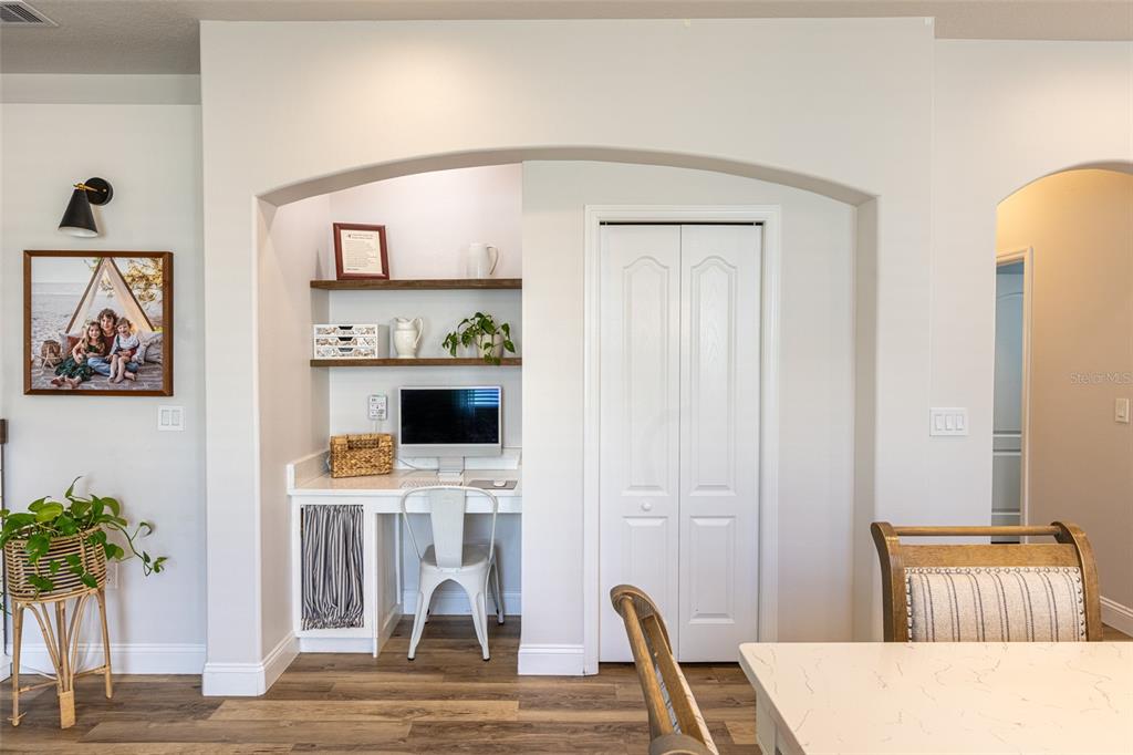 4136 Little Gap Loop Ellenton, FL 34222 - Photo 22 of 50 a workspace with furniture and wooden floor