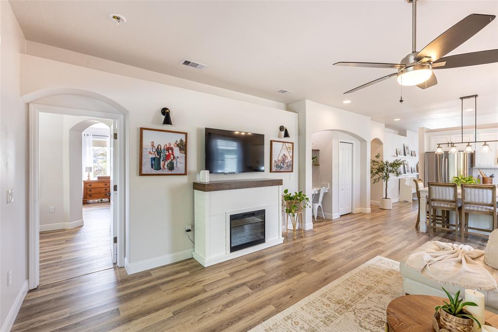 4136 Little Gap Loop Ellenton, FL 34222 - Photo 25 of 50 a living room with furniture a flat screen tv and a fireplace