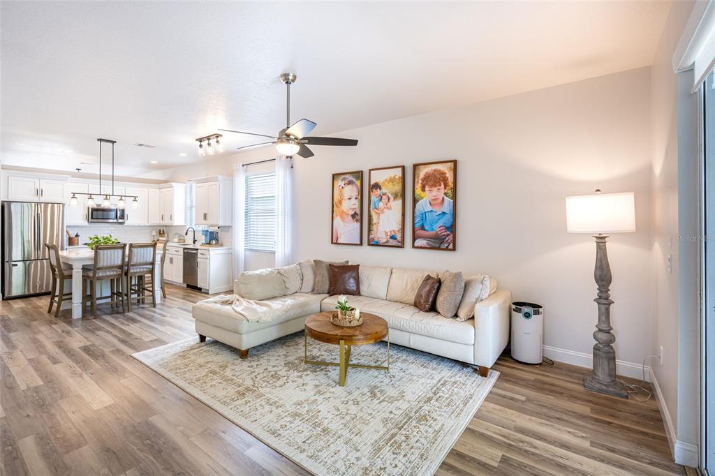 4136 Little Gap Loop Ellenton, FL 34222 - Photo 26 of 50 a living room with furniture and wooden floor