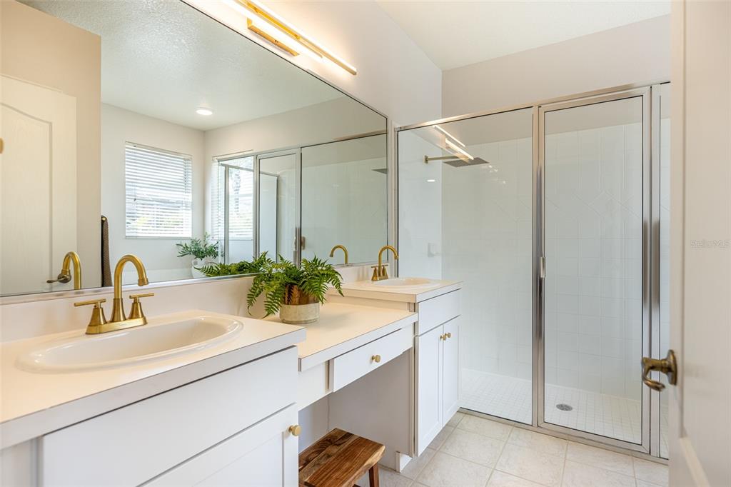 4136 Little Gap Loop Ellenton, FL 34222 - Photo 29 of 50 a bathroom with a sink and a mirror