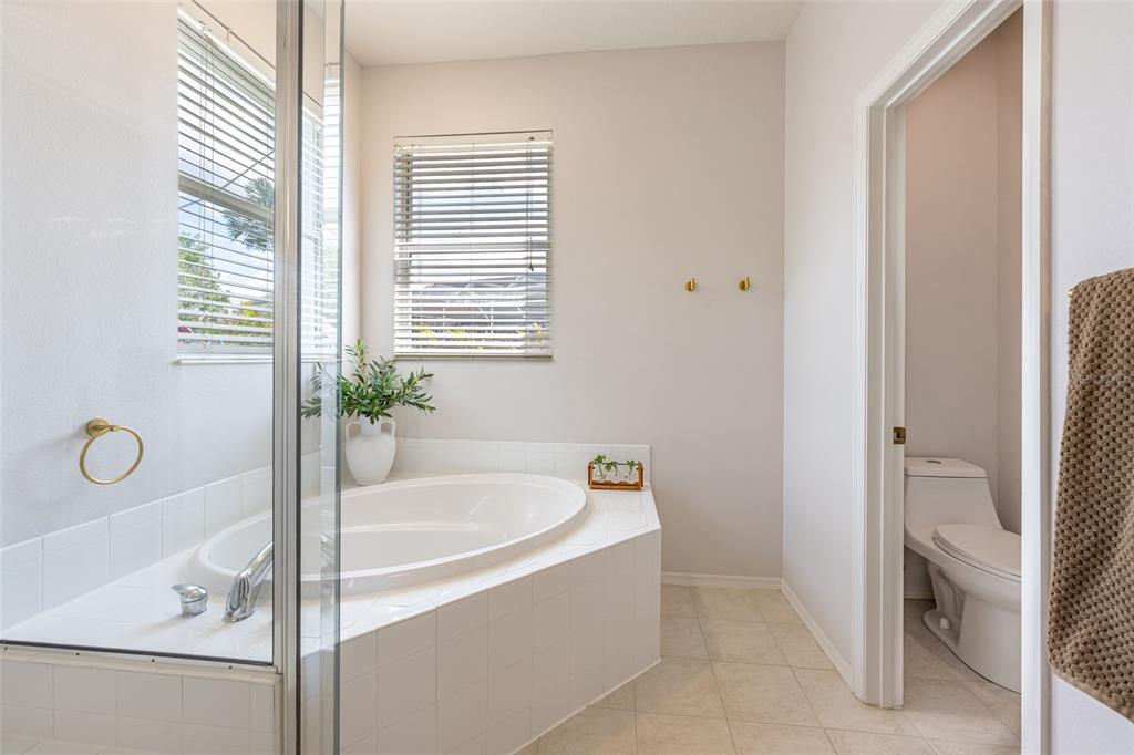 4136 Little Gap Loop Ellenton, FL 34222 - Photo 30 of 50 a white bath tub sitting next to a shower