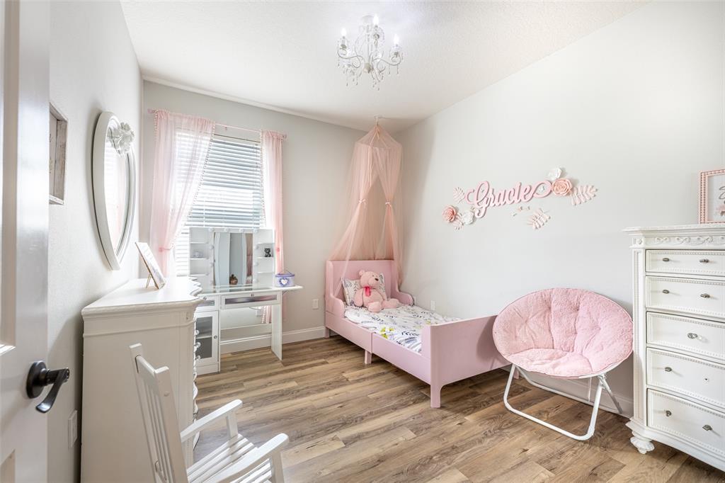 4136 Little Gap Loop Ellenton, FL 34222 - Photo 32 of 50 a bedroom with a bed and a dresser