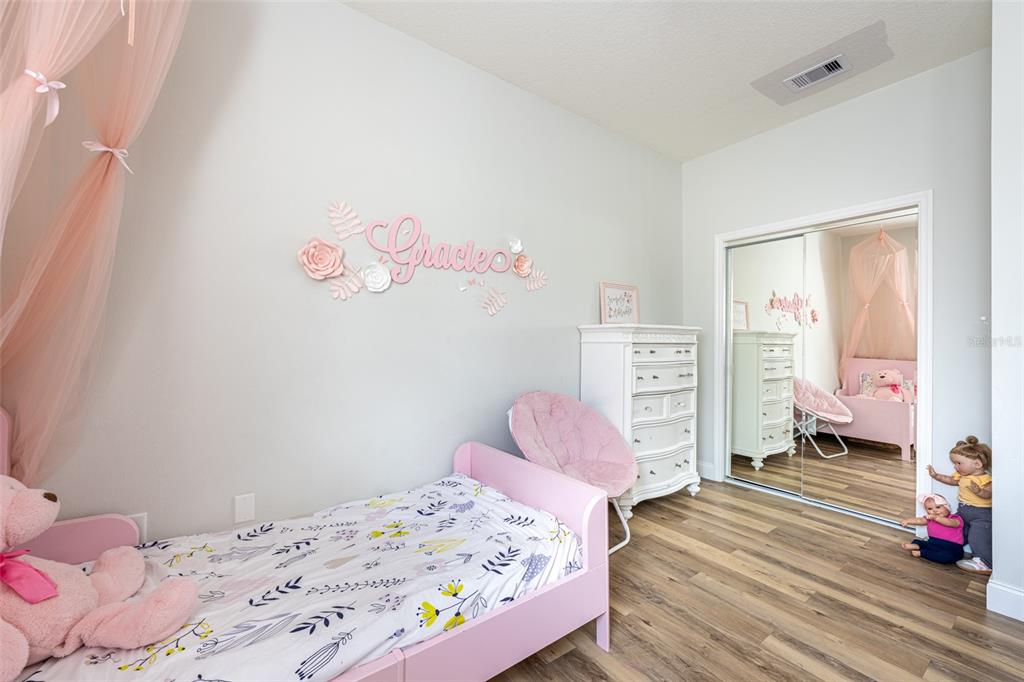 4136 Little Gap Loop Ellenton, FL 34222 - Photo 33 of 50 a bedroom with a bed and a window