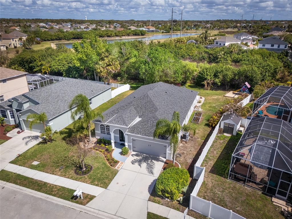 4136 Little Gap Loop Ellenton, FL 34222 - Photo 38 of 50 an aerial view of a house with a garden