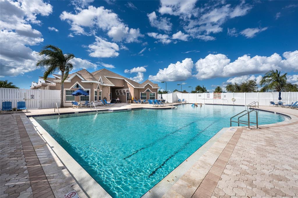 4136 Little Gap Loop Ellenton, FL 34222 - Photo 46 of 50 a view of a lake with a house in the background