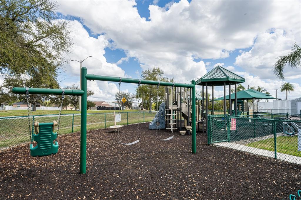 4136 Little Gap Loop Ellenton, FL 34222 - Photo 50 of 50 a view of a park with swings
