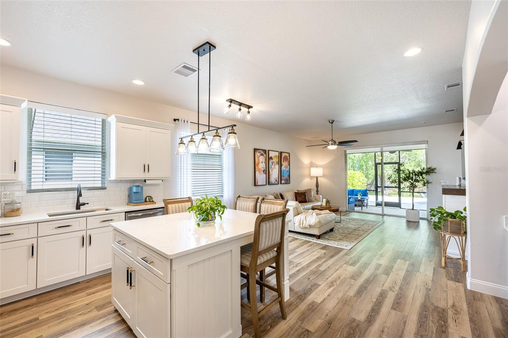 4136 Little Gap Loop Ellenton, FL 34222 - Photo 6 of 50 a large white kitchen with a large window