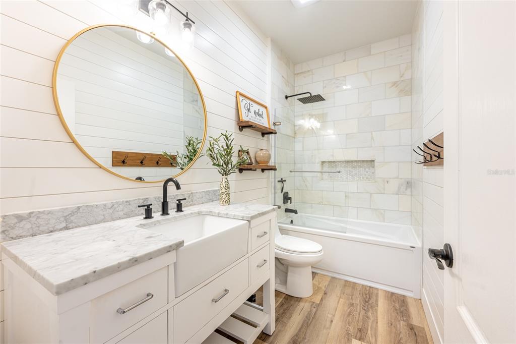 4136 Little Gap Loop Ellenton, FL 34222 - Photo 7 of 50 a bathroom with a granite countertop sink a toilet and a mirror