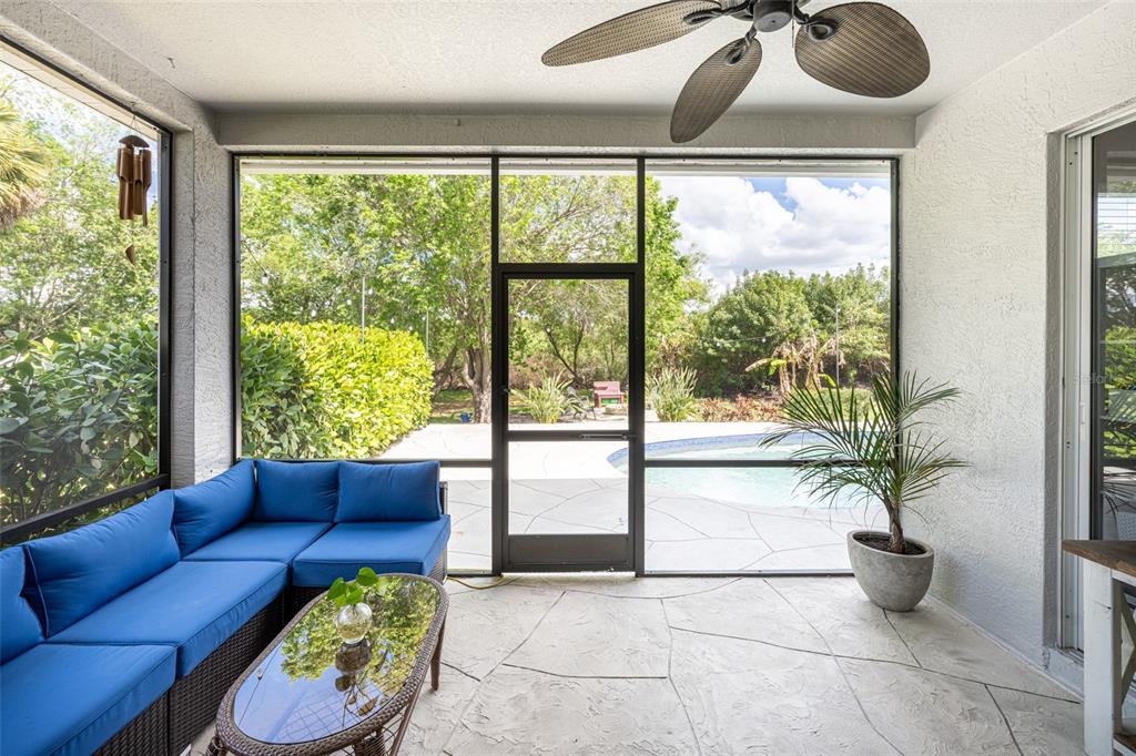 4136 Little Gap Loop Ellenton, FL 34222 - Photo 8 of 50 a living room with furniture and a floor to ceiling window