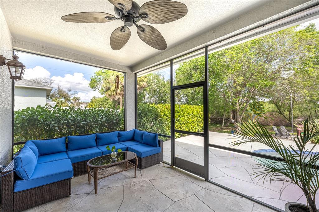 4136 Little Gap Loop Ellenton, FL 34222 - Photo 9 of 50 a living room with furniture and a floor to ceiling window
