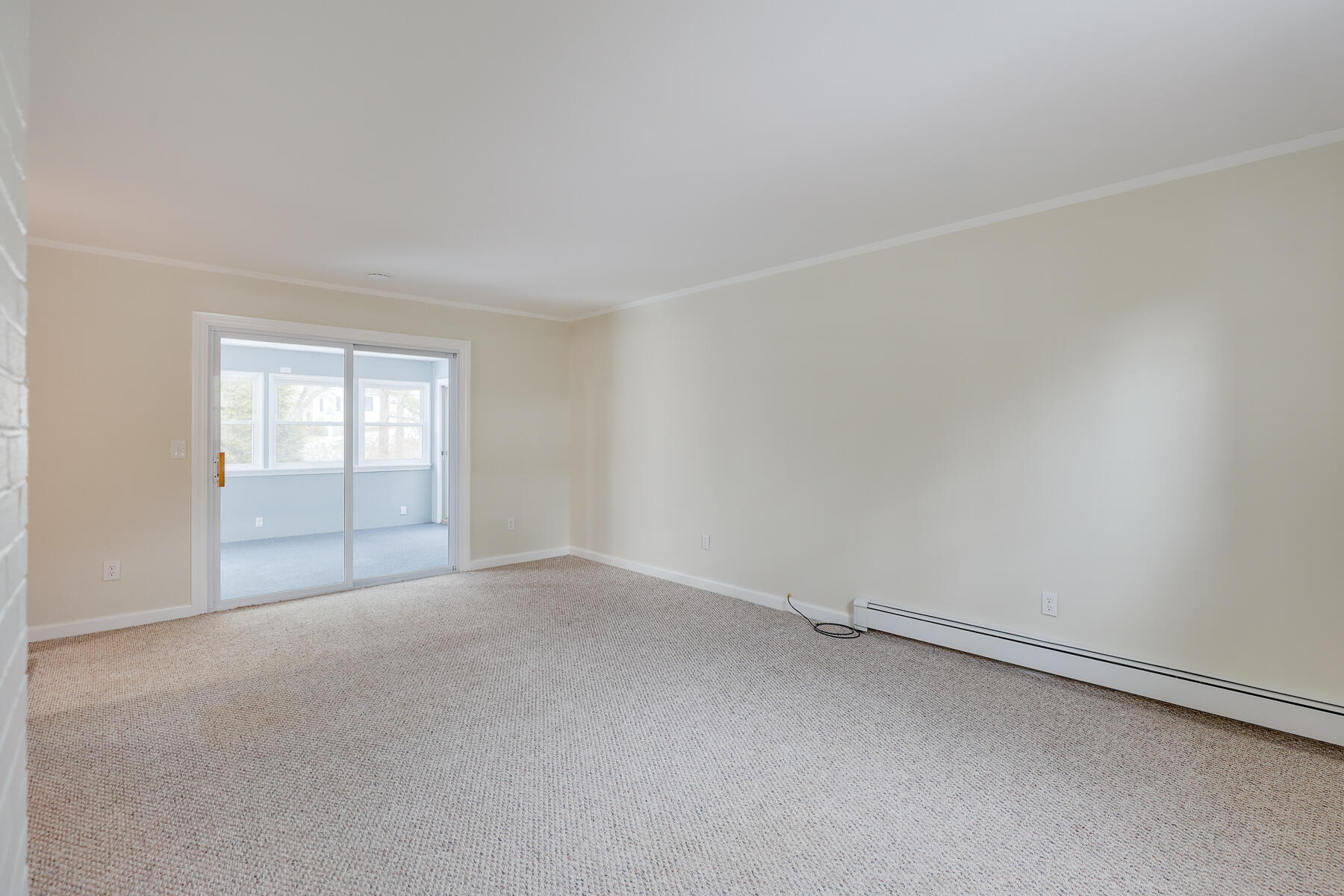 98 Long Road Harwich, MA 02645 - Photo 18 of 31 a view of an empty room with a window