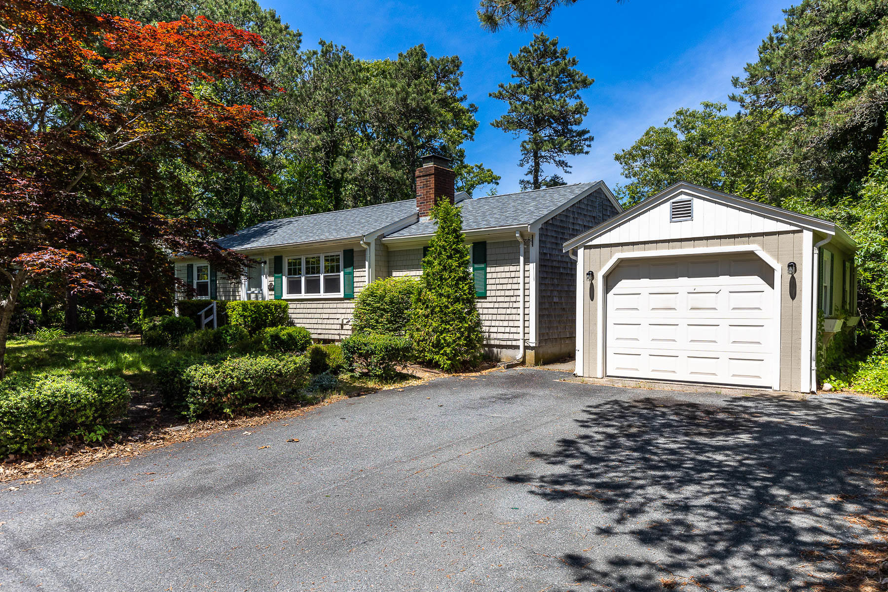98 Long Road Harwich, MA 02645 - Photo 2 of 31 a front view of a house with a yard