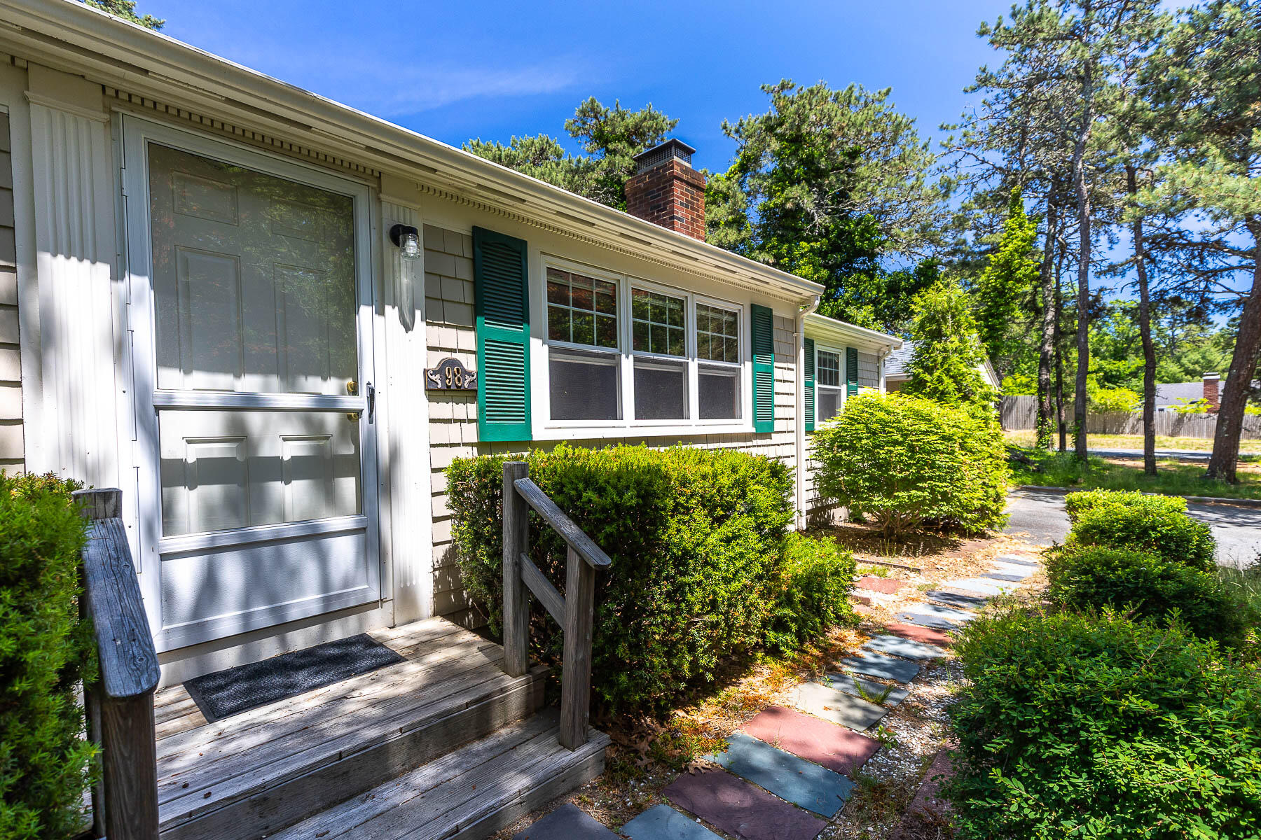 98 Long Road Harwich, MA 02645 - Photo 21 of 31 a front view of a house with a yard