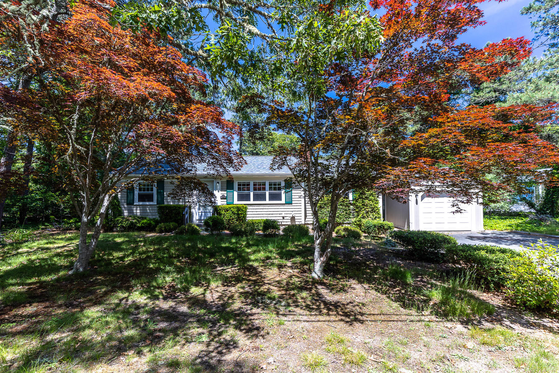 98 Long Road Harwich, MA 02645 - Photo 23 of 31 a front view of a house with a yard